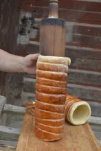 Taking off the cake from the baking spit — image 2